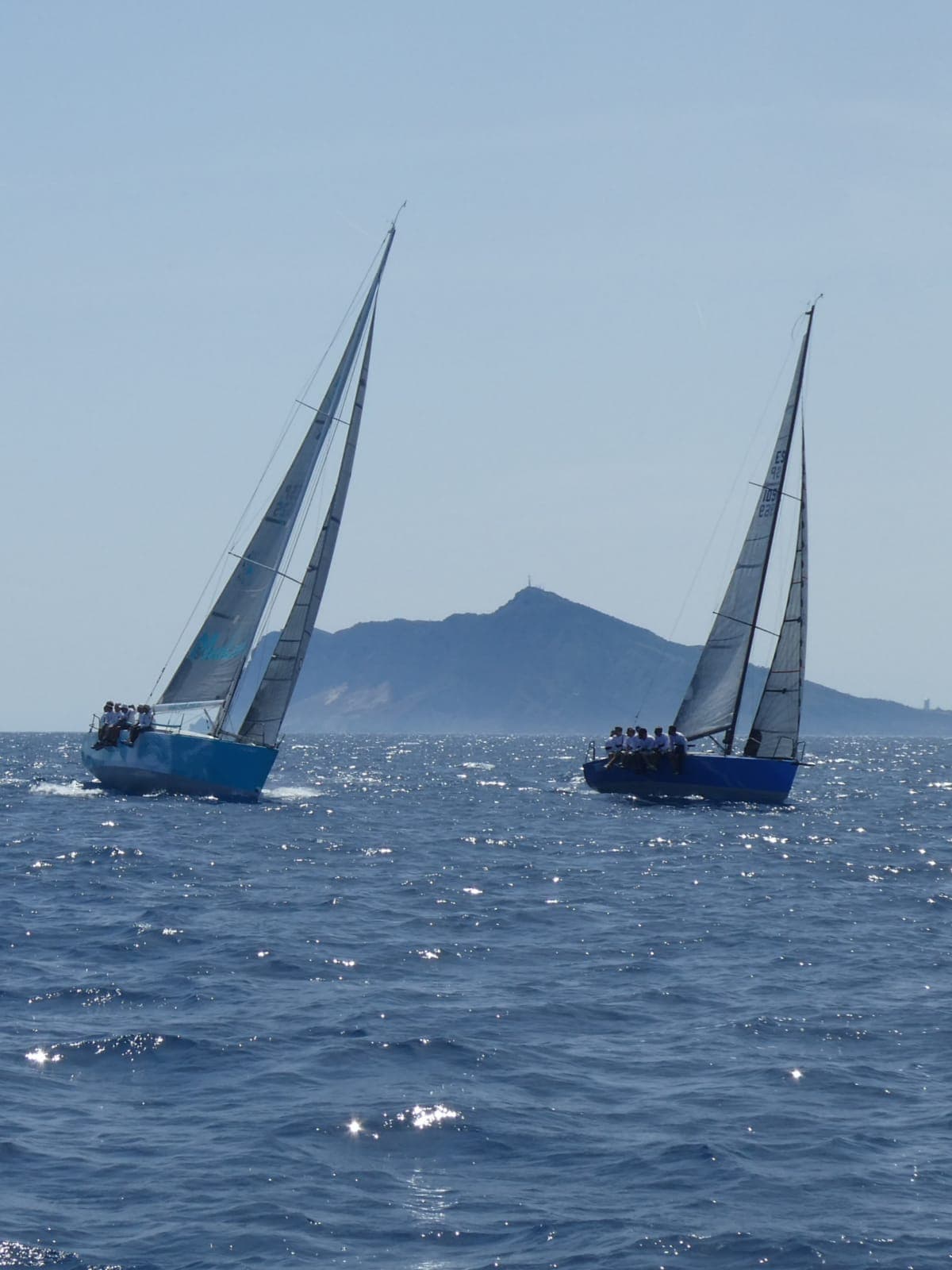 Team practising racing-style sail manoeuvres